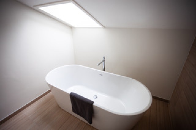 Dead eave space transformed into a light bathroom